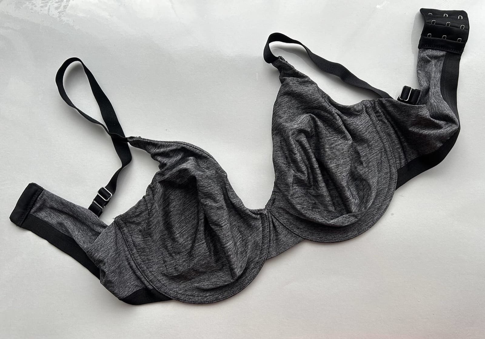 Grey underwire bra laid flat